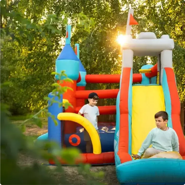 Children enjoying inflatable slide
